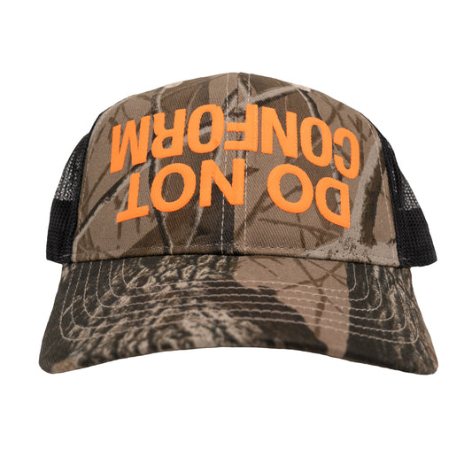 Do Not Conform "ndsᴉpǝ poʍu" Camo Trucker